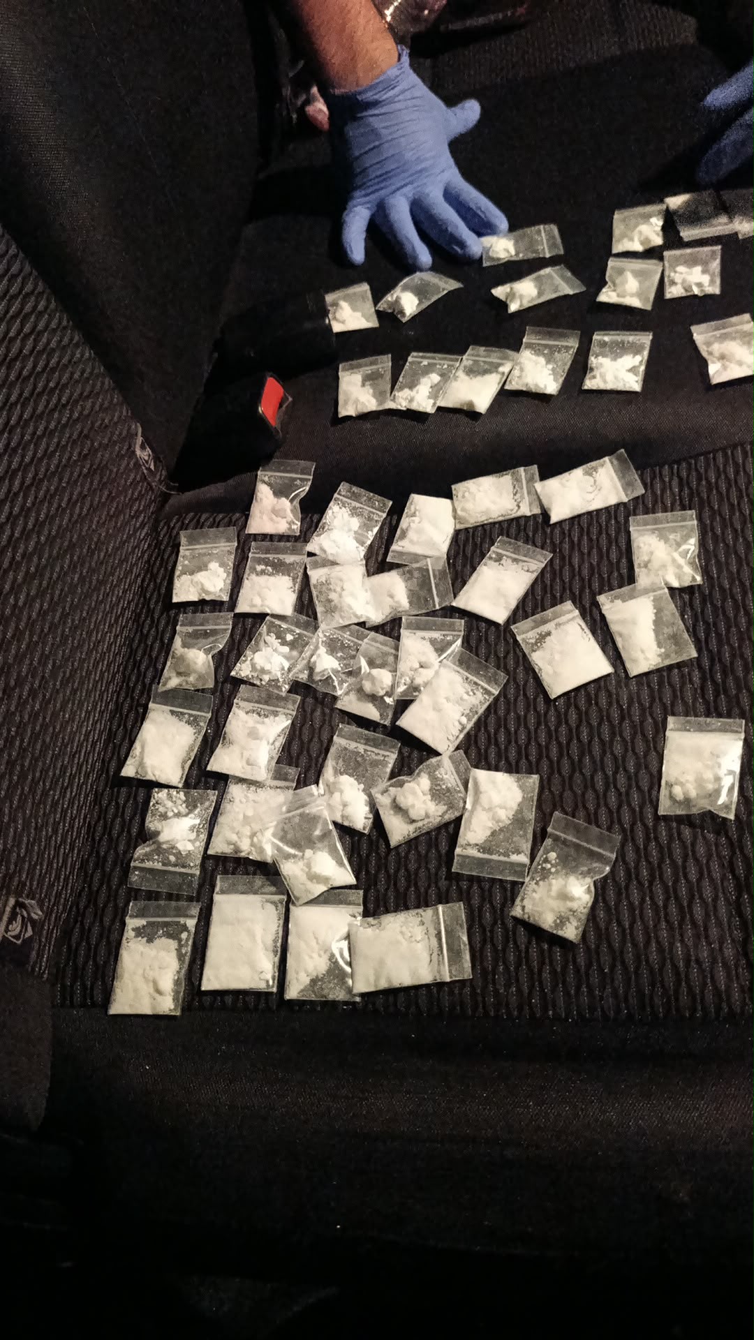 Small bags containing a white substance seized during an operation in Jaffa