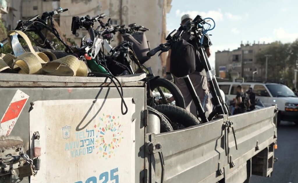 A municipal truck loaded with electric bicycles and scooters seized in Jaffa